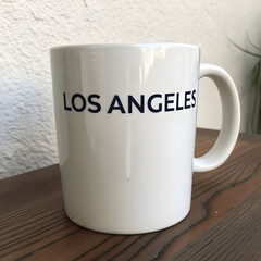 a white coffee mug with the word los angeles