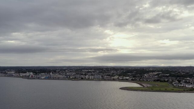 Wide aerial view of Salthill beneath a dramatic sky, Galway, Ireland.