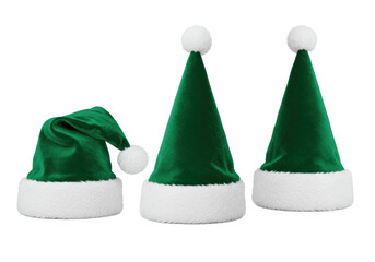 Three emerald green velvet Santa hats with white faux fur and pompoms, arranged on a transparent background with copy space, showcasing vibrant holiday cheer concept
