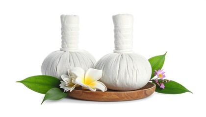 Two white, cloth-wrapped massage tools with stems, sitting on a wooden bowl with green leaves, white and yellow flower