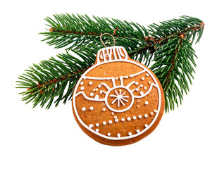 Festive gingerbread ornament on a pine branch