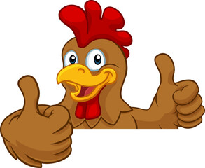 A chicken rooster cockerel bird cartoon character peeking over a sign and giving a thumbs up © Christos Georghiou