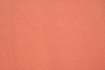 Fototapeta premium Peach Coral Textured Wall Background, Minimalist Pastel Earth Tone Surface.