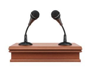 Two microphones on a polished wooden podium against a black background