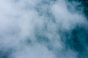 Billowing white clouds drift over a blue background, creating an abstract, minimal composition with gentle gradients and soft textures. The image evokes a tranquil, airy mood and a sense of calm © Florent