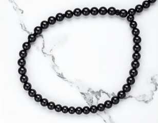 Black Pearl Tasbih Circular Flat Lay on Marble Luxury