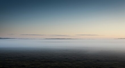 Naklejka premium A vast, expansive landscape shrouded in thick, dense atmospheric haze, obscuring the distant horizon and creating a mystical, serene environment, serene, monochrome, dull