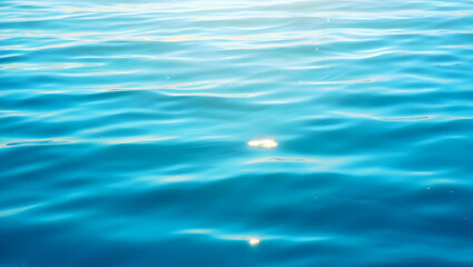 Calming ocean waves with sunlight reflections on water surface