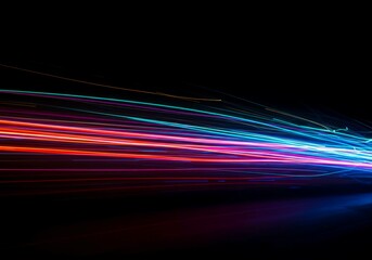 Vibrant abstract flow of multicolored light trails capturing dynamic movement across a dark background, dynamic, bright, winding