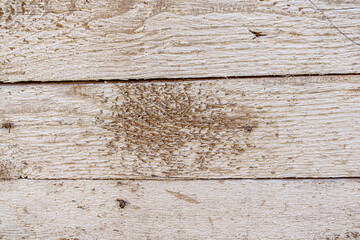 Detailed close up of rustic wooden planks with natural grain, rough texture, scratches, and weathered surface. Perfect background for design projects, vintage decor, carpentry, and creative artwork.