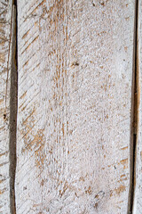 Detailed close up of rustic wooden planks with natural grain, rough texture, scratches, and weathered surface. Perfect background for design projects, vintage decor, carpentry, and creative artwork.