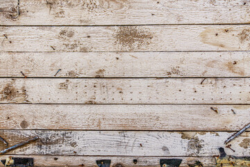 Detailed close up of rustic wooden planks with natural grain, rough texture, scratches, and weathered surface. Perfect background for design projects, vintage decor, carpentry, and creative artwork.