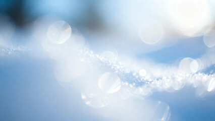 Close-up of snow crystals sparkling in sunlight with bokeh effect