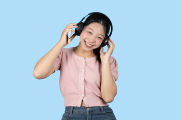 young teen girl happy smile enjoy music from phone, listening music by headphone studio isolated