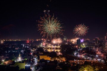 New year firework celebration in Chiang mai city, Thailand for background usage.