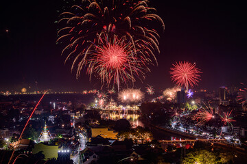 New year firework celebration in Chiang mai city, Thailand for background usage.