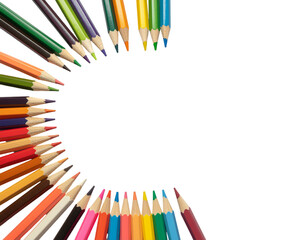 Colorful pencil array forms a circular frame around a white center