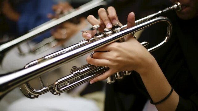 Close up hand of Trumpet Player Practicing in a Music Rehearsal Room