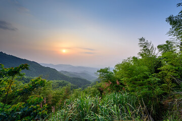 The stunning sight of the sun rising above the mountain