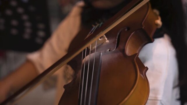Cinematic Close-Up of Violin Held by Musician During Rehearsal