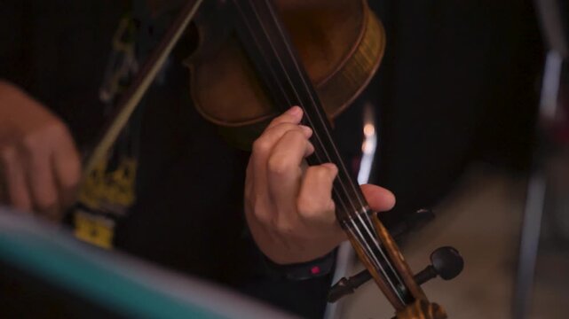 Cinematic Close-Up of Violin Held by Musician During Rehearsal