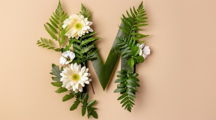 Fototapeta premium Floral Letter M Composition with Tropical Greenery and Natural Elements on Soft Beige Background