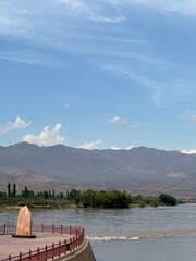 Summer scenery of the Yellow River (Huanghe) and stone tablet with words: 