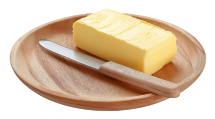 A block of yellow butter and a metal knife with a wooden handle on a round wooden plate isolated on a transparent background