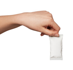 Human hand presenting a small sealed blank white sachet on a clean monochrome background &mdash; mockup for single-serve packaging, samples, condiments, cosmetics or branding