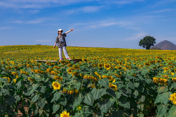 Girl Posing in Sunflower Field Outdoors