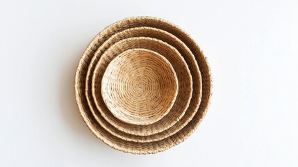 Four nested woven baskets arranged on a white background
