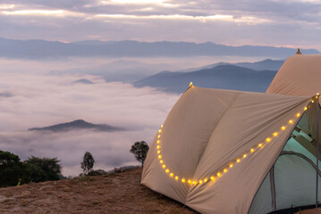 Camping tents in the mountains, and morning mist.