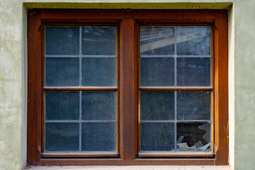 Fototapeta premium old wooden window with a broken one