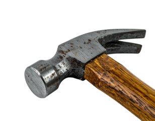 Close-up of a well-used hammer, metal head and wooden handle, against a black background