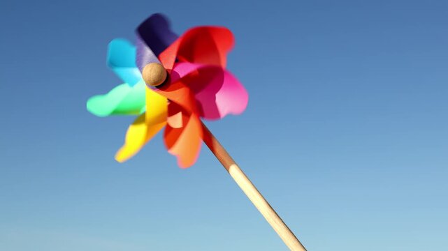 A pinwheel spinning against the blue sky