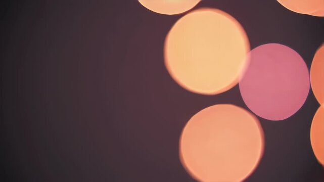 Warm bokeh lights in dark background for creative projects