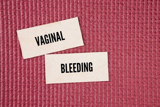 Paper with the words Vaginal bleeding. normal during periods but becomes abnormal AUB when it happens outside cycles, is unusually heavy, or occurs post-menopause