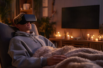 male relaxing on couch with vr headset during evening, immersive digital experience in cozy living room atmosphere, calm lifestyle moment, concept of mental health tech