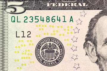 Obraz premium Concept of money. Finance. Part of a 5-dollar bill.