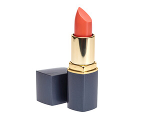A single lipstick tube stands upright, with its cap next to it, against a stark black background