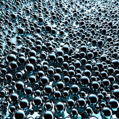 A dynamic arrangement of reflective metallic spheres creating an abstract surface.