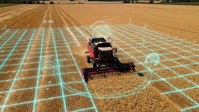 Modern combine harvester utilizing advanced technology in a golden wheat field.