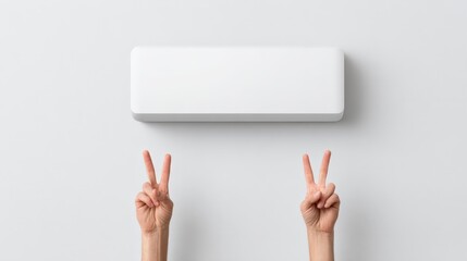 Two Hands Making Peace Signs with a Blank Wall Background