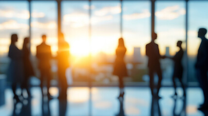 Blurred image of business people socializing at a corporate event or office party, capturing movement, networking, and the lively atmosphere of professional gatherings