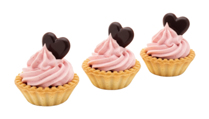 Tartlets with strawberry mousse, topped with chocolate hearts isolated on transparent background