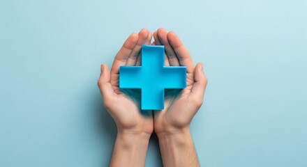 Hands holding a blue medical cross symbol representing healthcare support and medical assistance on a light blue background for health and wellness themes