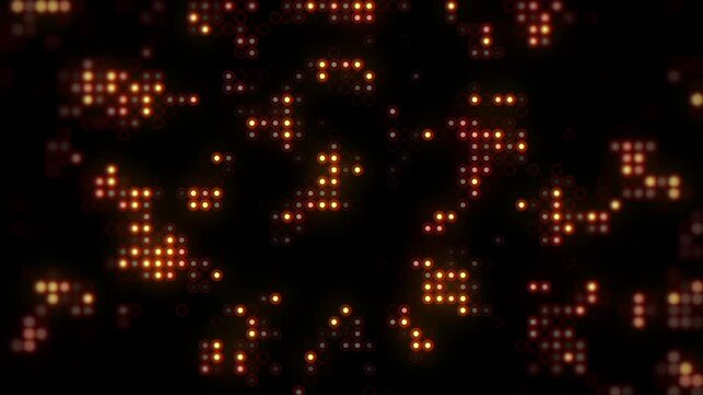 Glowing orange led light circles flashing on black digital wall