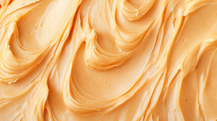 Creamy peanut butter texture in warm golden tones forms a smooth, appetizing background ideal for sweets branding, bakery advertising, food design, and dessert visuals