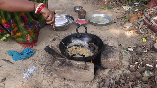 Rural Indian Woman Cooking Outdoors in Traditional Village Kitchen, Preparing Food on Wood Fire Chulha, Authentic Indian Lifestyle, Culture and Rural Life