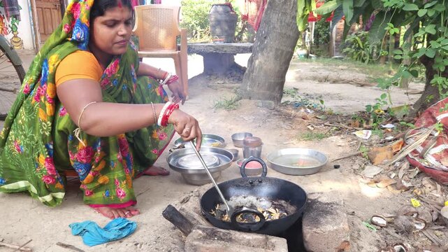 Rural Indian Woman Cooking Outdoors in Traditional Village Kitchen, Preparing Food on Wood Fire Chulha, Authentic Indian Lifestyle, Culture and Rural Life